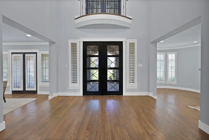 Grand entry hall with tall double front doors