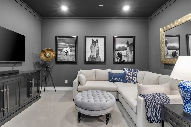 Styled living room with a sectional and framed photography